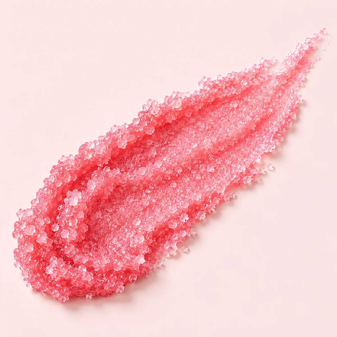 Trazo del exfoliante rosa de cristales de azúcar